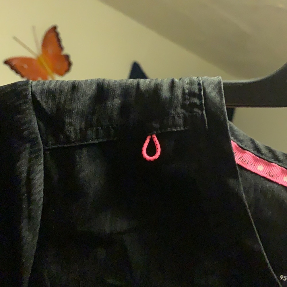 Two pairs of scrub pants and a matching shirt